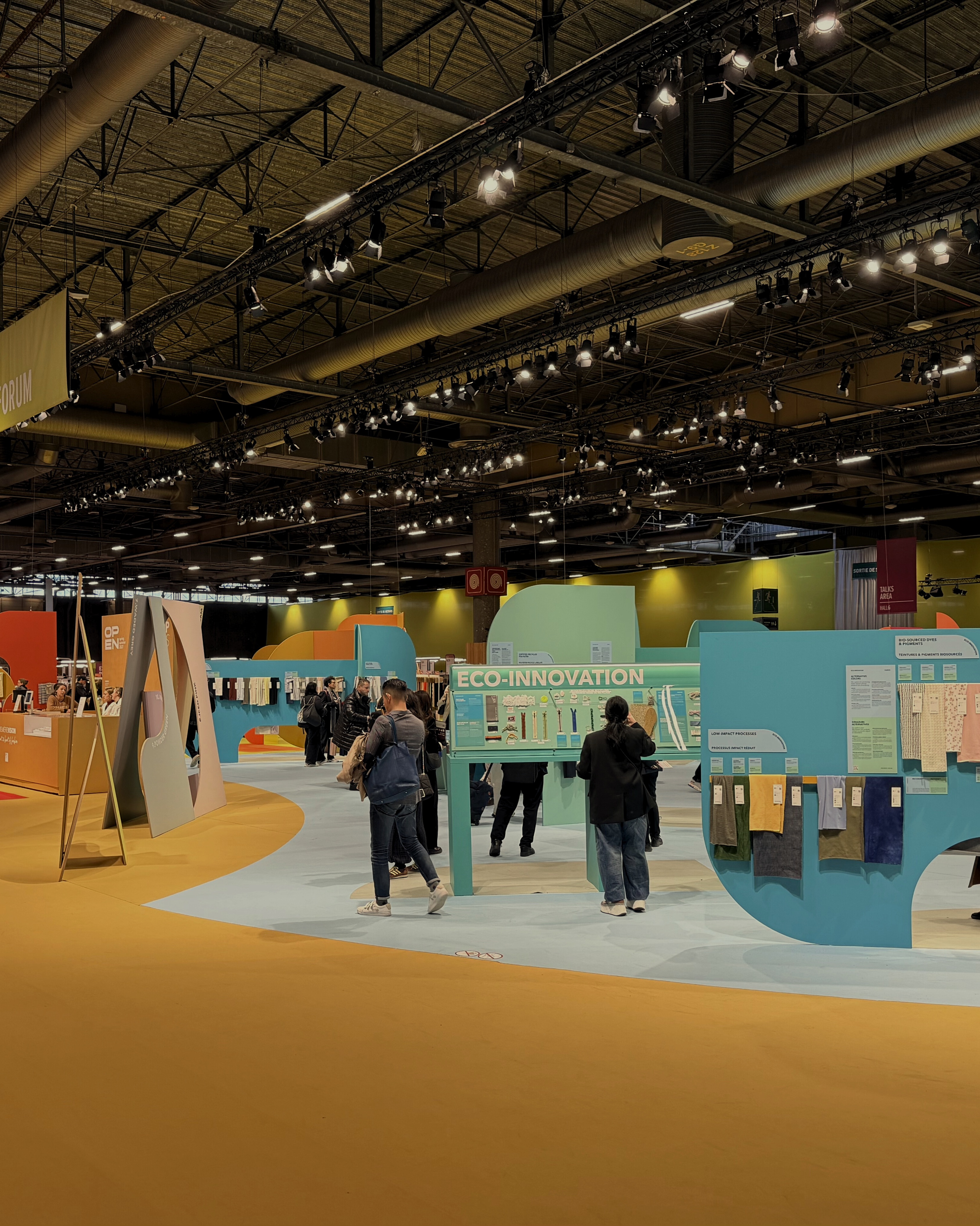 Textile trade show floor where Inniss Pearl Group sources manufacturing partners