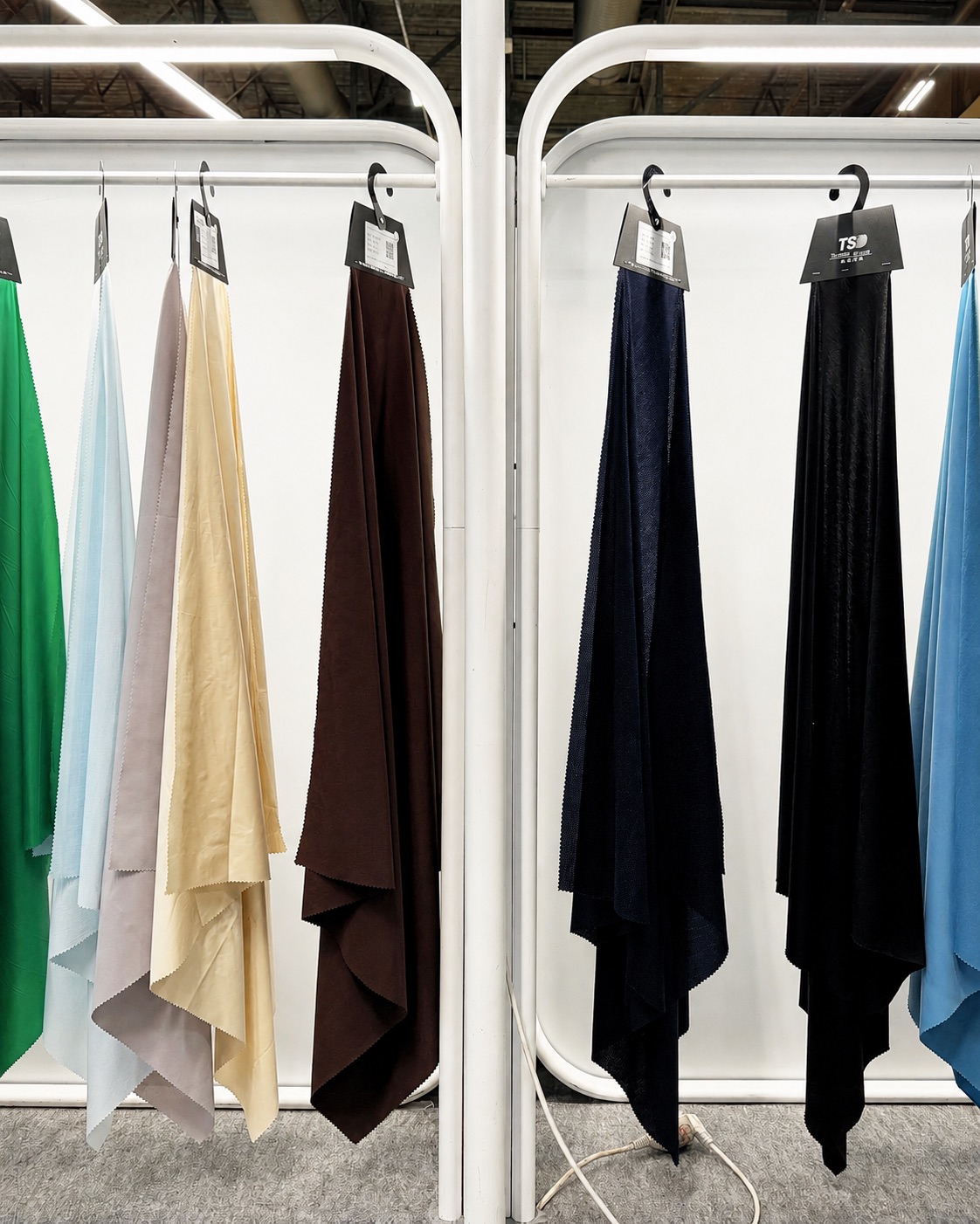 Fabric swatches in a range of colors sourced for apparel production